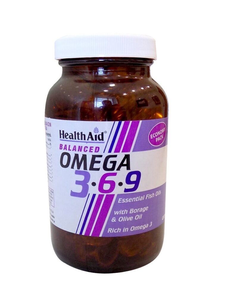 Καφέ μπουκάλι με την ένδειξη "Health Aid Omega 3-6-9 90 caps" με μοβ τόνους, που περιέχει αιθέρια έλαια ψαριών. Το Health Aid Omega 3-6-9 προσφέρει ένα ισορροπημένο μείγμα θρεπτικών συστατικών για την ευεξία σας.