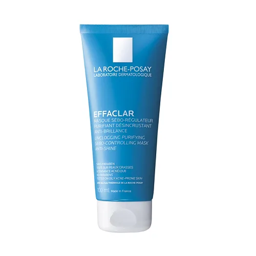 Ένα μπλε σωληνάριο La Roche Posay Effaclar Mask 100 ml διαθέτει λευκό κείμενο και λογότυπο, που υπόσχονται να καθαρίσουν και να ξεφράξουν τους πόρους ενώ ελέγχει τη λάμψη.