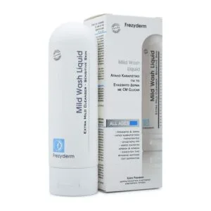 Ένα μπουκάλι Frezyderm Mild Wash Liquid 200 ml για ευαίσθητο δέρμα είναι κομψά τοποθετημένο δίπλα στο κομψό κουτί συσκευασίας του.