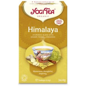 Ένα κίτρινο κουτί Yogi Tea Himalaya 34 g, ένα βιολογικό Αγιουρβεδικό μείγμα εμπλουτισμένο με τζίντζερ, μάραθο και κανέλα.