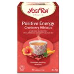 Κουτί Yogi Tea Θετικής Ενέργειας Cranberry Hibiscus 30,6 g με εικόνα ενός αχνιστού φλιτζανιού και ζωηρά floral διακοσμητικά.