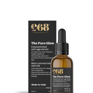 Ένα καφέ σταγονόμετρο και κουτί με την ένδειξη "e68 The Pure Glow – Concentrated Anti-Aging Serum 30ml" υπόσχονται λαμπερό δέρμα με ισχυρή, στοχευμένη φόρμουλα.